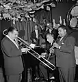 Art Hodes new band at the "Ole South" lines up with (left to right) George Luggi on trombone, Pops Foster on bass, Henry Goodwin on trumpet, Hodes on piano, Cecil Scott on clarinet and drummer Baby Dodds, is hidden
