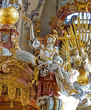 St George dressed in crusader plate armour and holding a lance