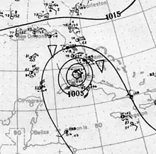 Map showing shorelines and the coordinate grid in light gray. Black contours on the map denote isobars; the presence of concentric isobars at the center of the image denote the location of a tropical cyclone.