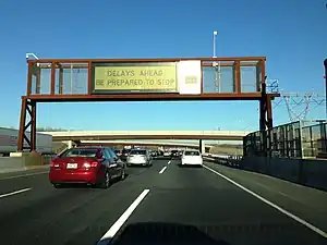 A Daktronics rear access color LED sign on the New Jersey Turnpike, USA, displaying a warning about congestion ahead