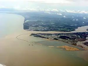 End of Nandu river flowing around Xinbu Island (right) into Qiongzhou Strait (left)