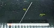 Alpha particles and electrons (deflected by a magnetic field) from a thorium rod in a cloud chamber