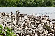 Cairn artwork along the shore