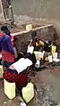 People in Uganda filling up water canisters (here around 5-20&nbsp;L).