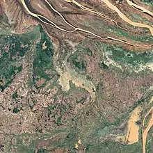 Satellite image of a river flooding.