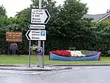 Entrance to the village, with floral boat display