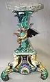 Gustafsberg Jardiniere Stand, coloured glazes, c. 1878, naturalistic with mythological theme, Sweden.
