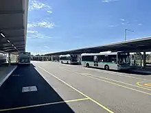 Road with bus stops and canopy shelter along the sides