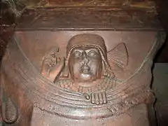 Male Figure on top of Column