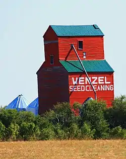 Grain elevator originally from Lemsford, now located at a farm south of Leader, on Highway 21.