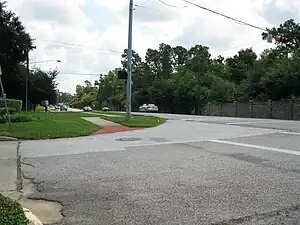 View is east on Memorial Drive at W. Forest. Approaching cars are on the downthrown side of the Long Point Fault.