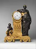 French Neoclassical mantel clock ("Pendule Uranie"); 1764–1770; case: patinated bronze and gilded bronze, Dial: white enamel, movement: brass and steel; 71.1 × 52.1 × 26.7&nbsp;cm; Metropolitan Museum of Art