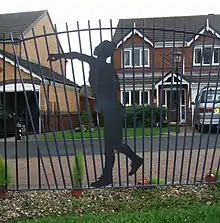 Fence in Sanderson Park, depicting a silhouetted javelin thrower