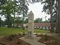 This obelisk erected in 1976 in Bicentennial Park in Haynesville is dedicated to the medical profession. The site is at the former location of a hospital.