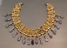 Collier; late 6th–7th century; gold, an emerald, a sapphire, amethysts and pearls; diameter: 23&nbsp;cm (9.1&nbsp;in); from a Constantinopolitan workshop; Antikensammlung Berlin (Berlin, Germany)