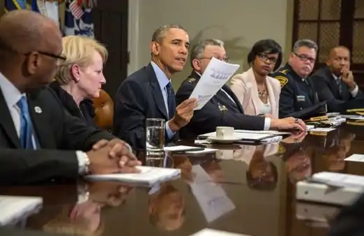 President Barack Obama and members of the President's Task Force on 21st Century Policing meet with the press on March 2, 2015, to discuss the interim report of the task force.