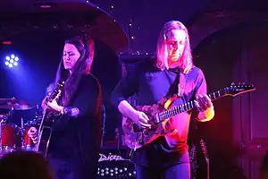 Members of Panic Room perform in July, 2017