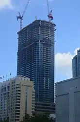 Panorama Tower under construction in October 2016 at about 60 floors. The building will be significantly larger than other skyscrapers in Florida. The design variation at about 50 floors is the 48th floor amenity deck.