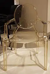 Louis Ghost, a simplified reinterpretation of armchairs in the Louis XVI style; by Philippe Starck; 2009; polycarbonate; height: 94&nbsp;cm; various locations