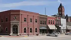 The Plattsmouth Main Street Historic District is listed in the National Register of Historic Places. At upper right is the clock tower of the Cass County Courthouse.