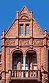 Corner gable of terracotta with granite column, Prudential Assurance Building, Bradford
