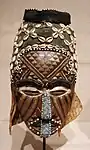 Ngaad-A-Mwash mask; by artists of the Kuba people; late 19th-early 20th centuries; wood, shells, glass beads, raffia and pigment; height: 82&nbsp;cm; Detroit Institute of Arts, Detroit, Michigan, US
