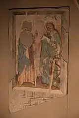 Painting of a man and a woman, face to face, dressed in blue dresses.