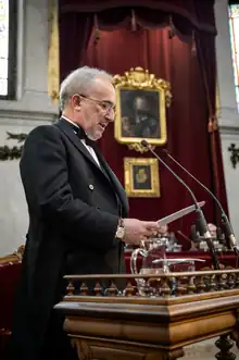 Muñoz at a lectern