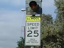 A school zone sign in the United States. When the light flashes, the set speed limit (in this case, 25&nbsp;mph (40&nbsp;km/h)) is active.