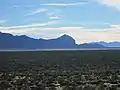 View of the Sonoran Desert from Huerfano Butte. The southern end of the Santa Rita Mountains can be seen in the background.