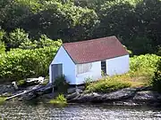 The boathouse&nbsp;— The ridge is parallel to the ground, but the ends and the window are vertical