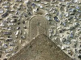 A photograph of St&nbsp;Andrew's tide dial in Bishopstone, East Sussex, England