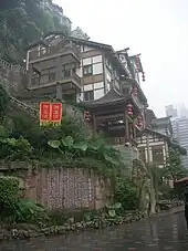 Hongya Cave stilted houses in traditional Bayu-style architecture