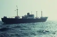 And now astern, the dipped stern flag and the house flag at the top of the mainmast