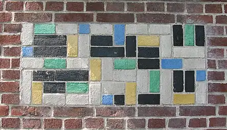 De Stijl - Panel of polychrome bricks on the exterior of the Vakantiehuis De Vonk&nbsp;[nl], a house in Noordwijkerhout, the Netherlands, by Theo van Doesburg, 1917-1919