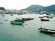 Yung Shue Wan bay boats resting in the low tide.