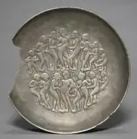 Tribhanga poses in a scene of people celebrating a festival, a rare example of secular Gupta art