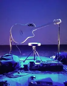 A guitar on a pedestal