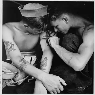 Much tattooed sailor aboard the USS New Jersey [Dec 1944]