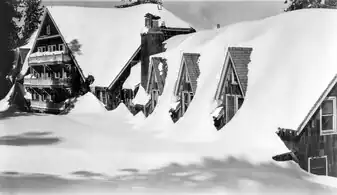 Heavy snowfall reaching the second story.